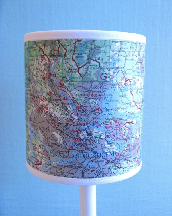 The map lamp lit, showing the ghost of the print from the reverse of the map