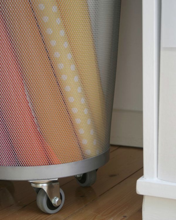 The bin from floor level, showing the castors under the rim